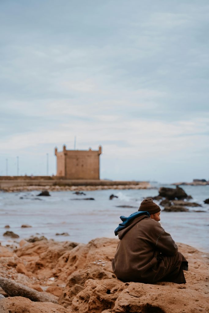 Moroccan old man siting at the habour of Essaouria