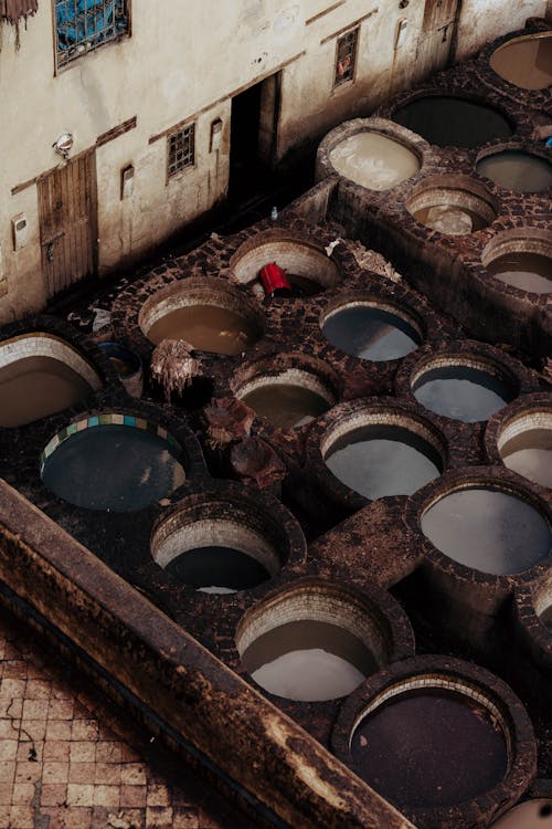 Free Aerial view of a traditional Marrakesh tannery with water vats for leather tanning. Stock Photo