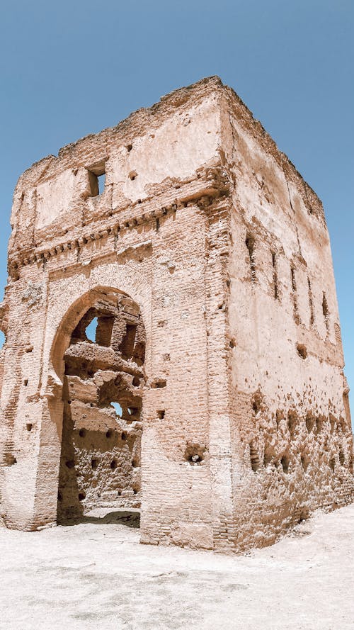 Discover the historic Marinid Tombs in Fez, Morocco, with their ancient ruins set against a vibrant, clear sky.