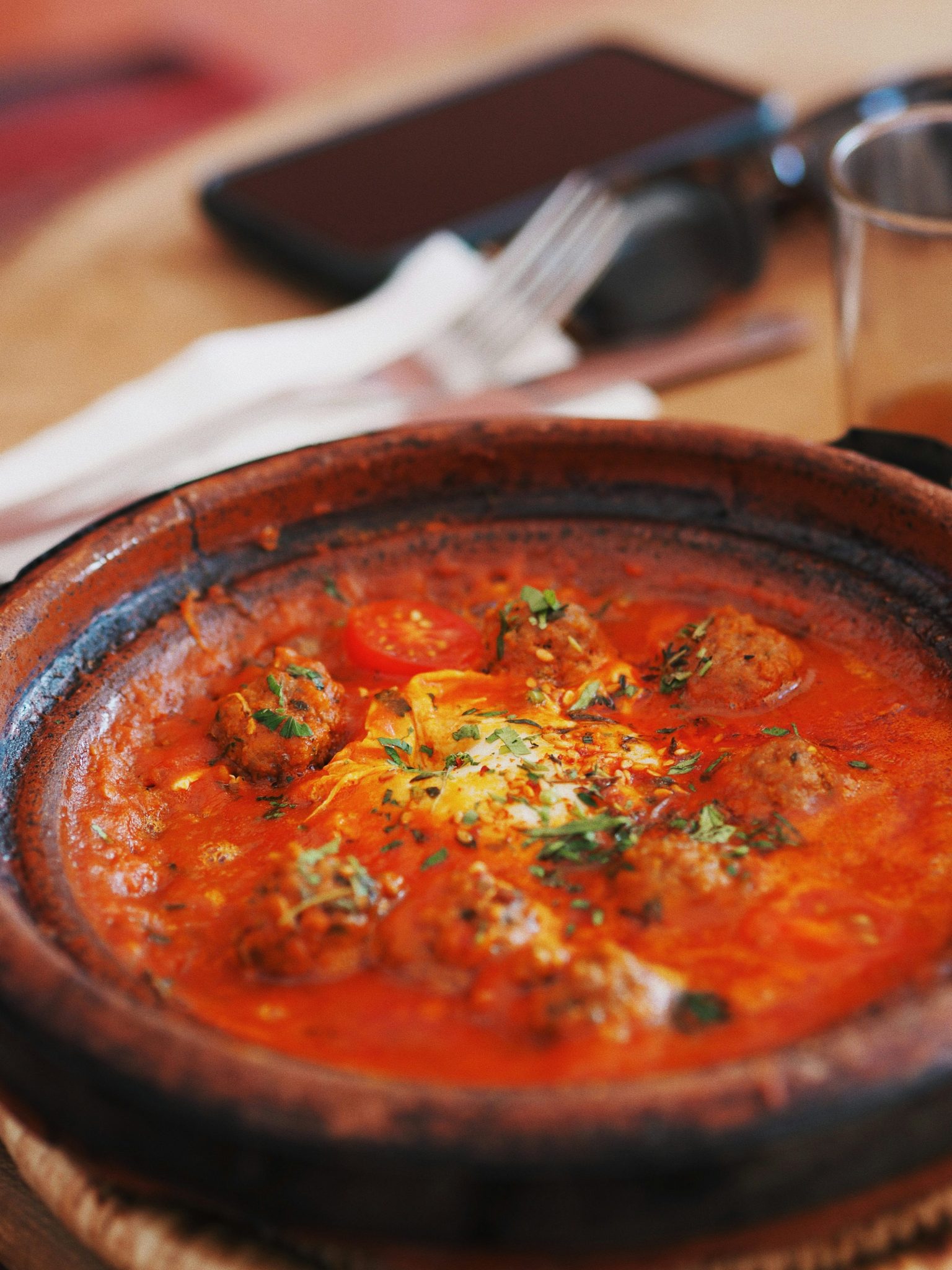 a bowl of moroccan shakshuka on a table
