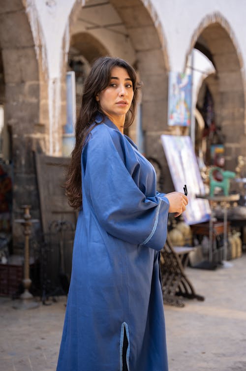 Moroccan woman wearing djellaba while walking the souks