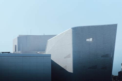 Free Modern building facade with unique design in Casablanca under clear skies. Stock Photo