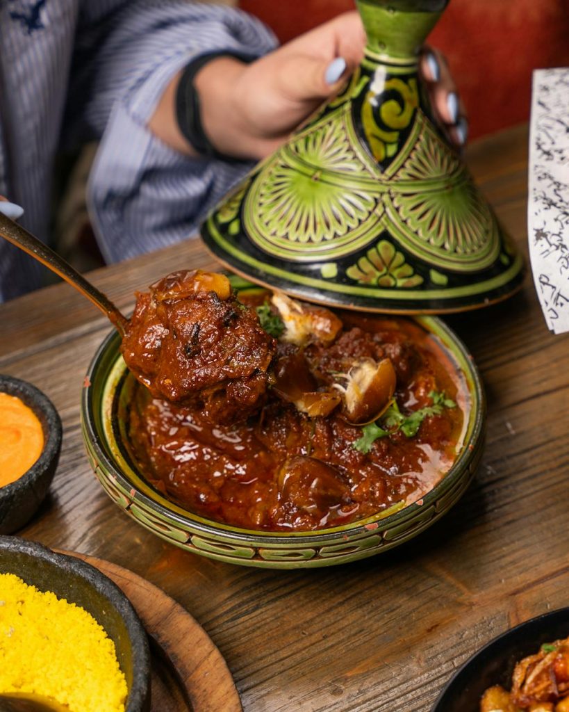 woman eating meal in handmade bowl