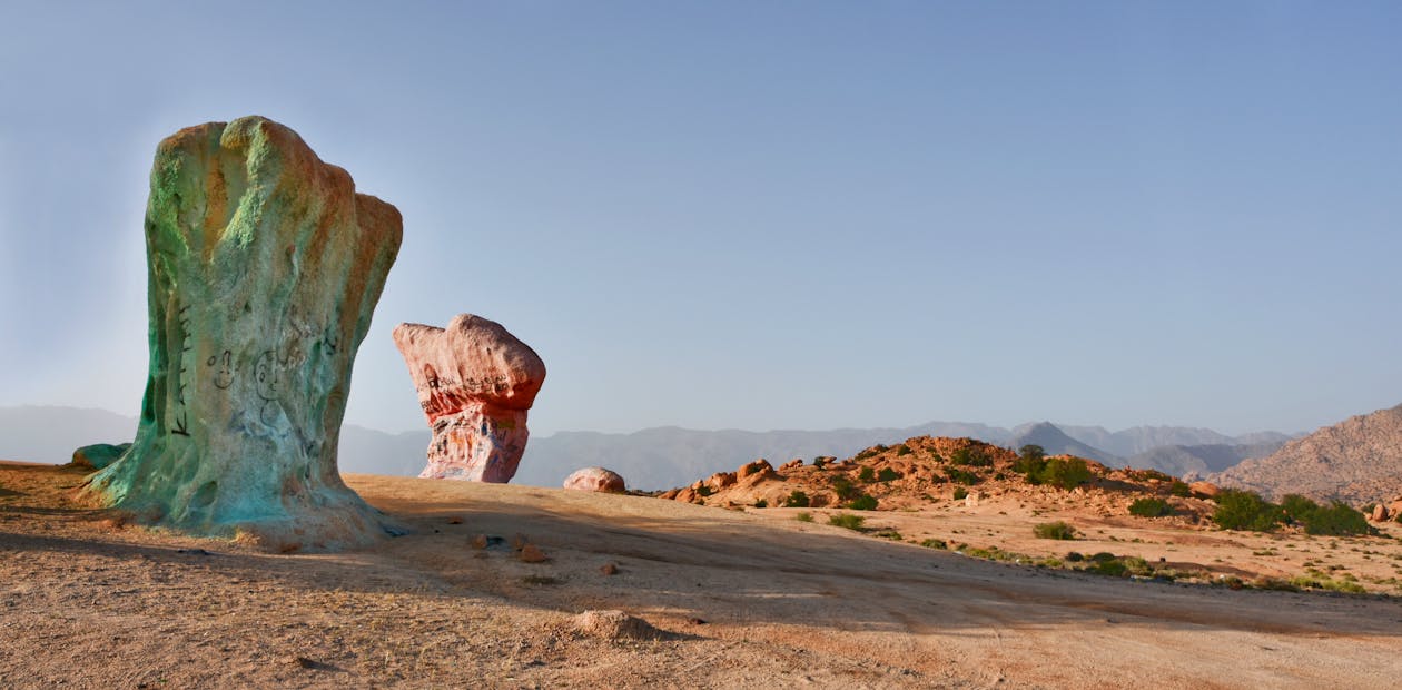 Free View of the iconic painted rocks in Tafraoute, Morocco, under a clear sky. Stock Photo